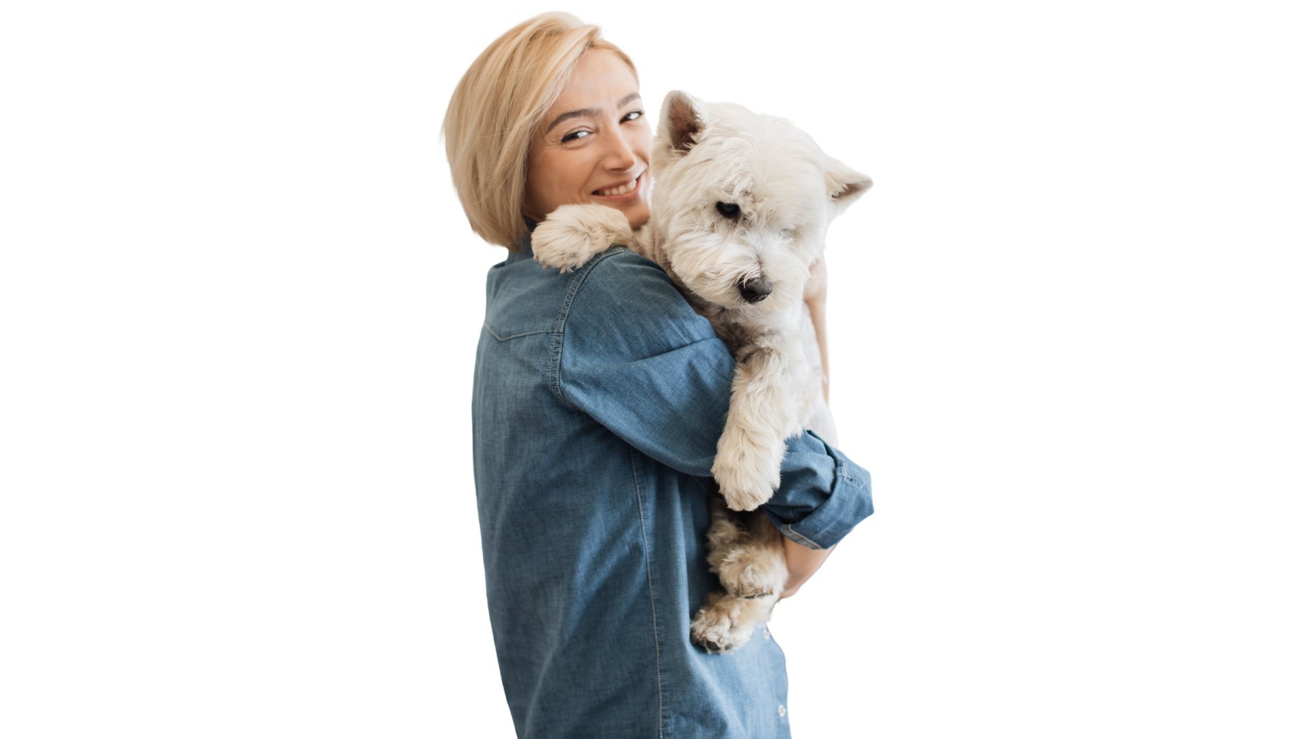 smiling woman hugging a white dog